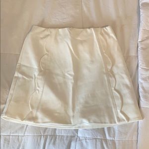white/cream skirt with scalloped detail